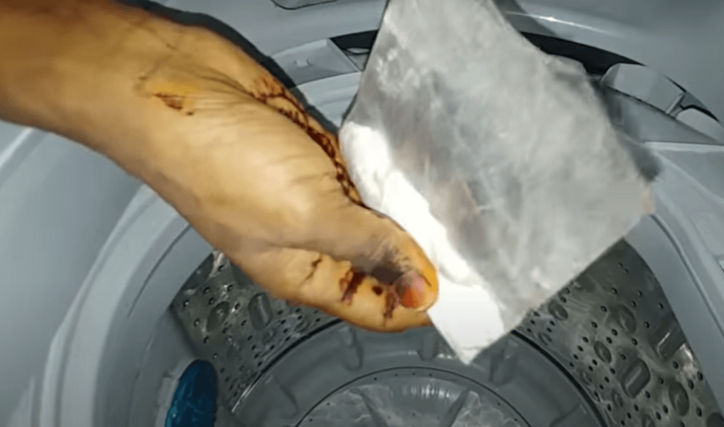 How to Clean a Top Loader Washing Machine? Run the cycle using baking soda